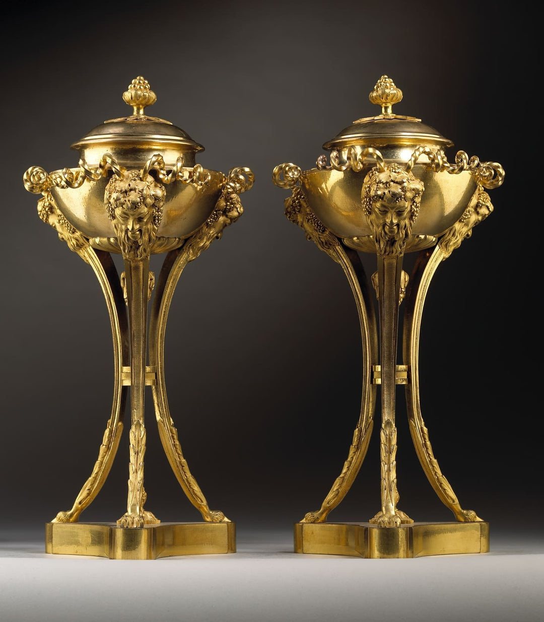 Pair of Louis XVI gilt bronze cassolettes with bacchanalian masks and rams feet by Nicholas Wells Antiques