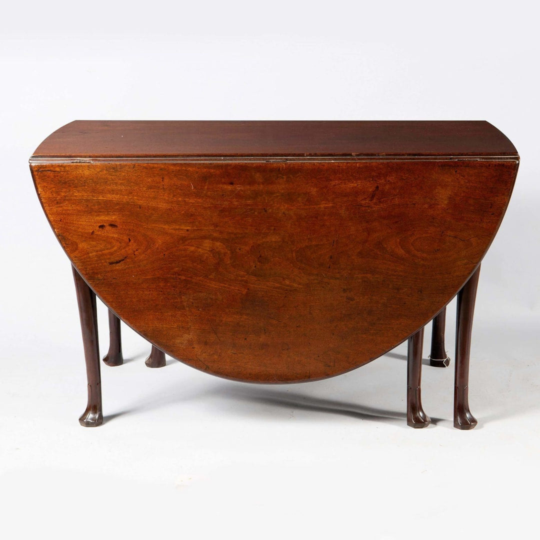 Irish George II mahogany oval drop leaf table with cabriole legs and Irish fluted pad feet circa 1740