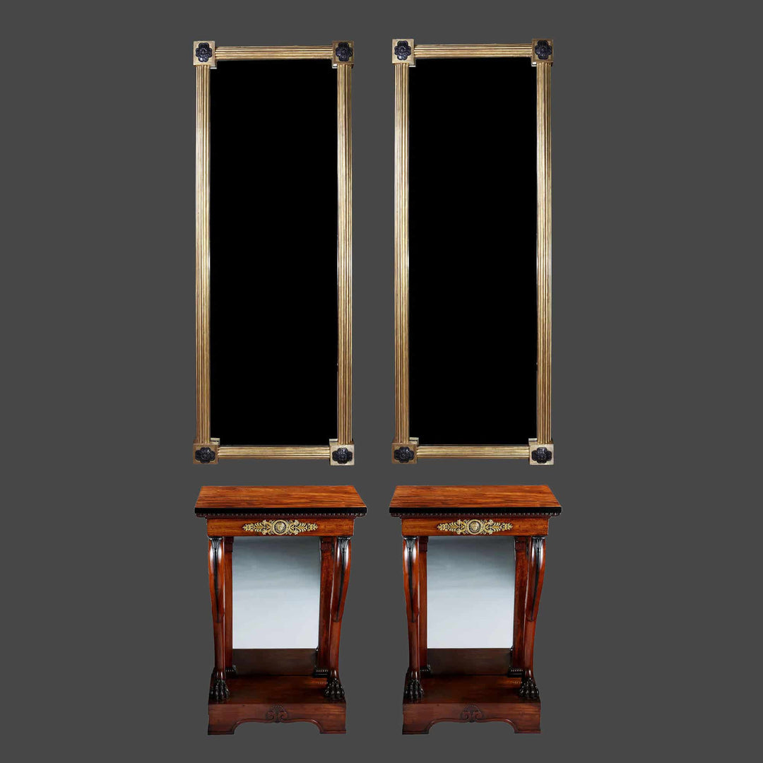 Pair of Regency Pier Console Tables with mahogany tops, gilt bronze mounts, scrolled legs, lion feet, and inset mirror backs.