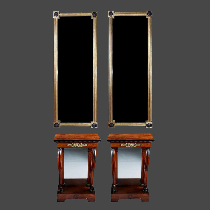 Pair of Regency Pier Console Tables with mahogany tops, gilt bronze mounts, scrolled legs, lion feet, and inset mirror backs.