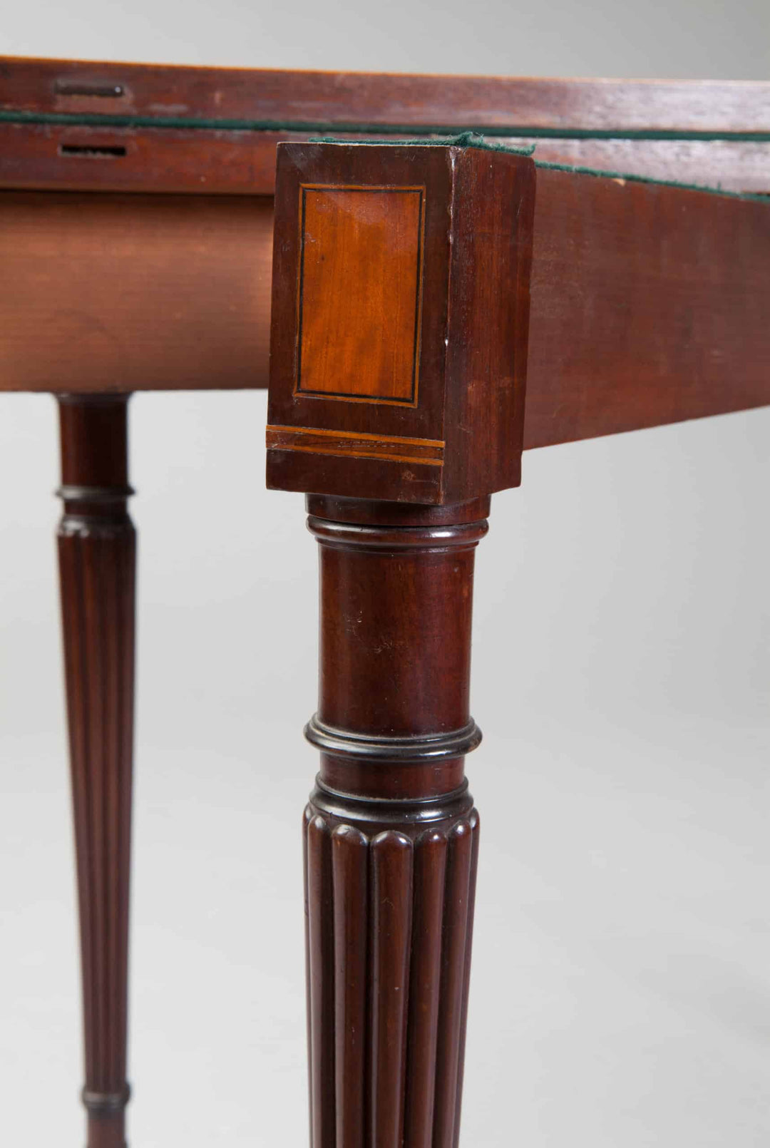 Pair Of George III Hepplewhite Mahogany Card Tables Attributed To Gillows with fluted legs and satinwood banding detail.