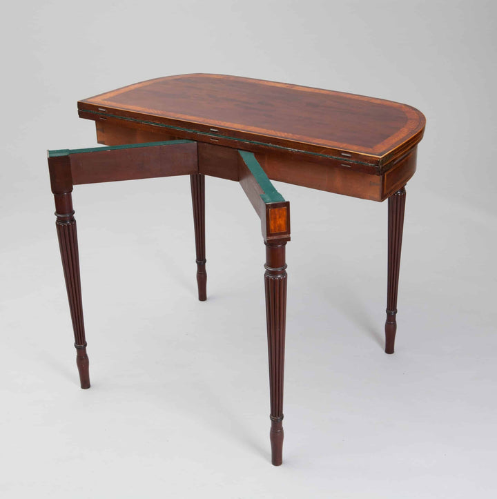 Pair Of George III Hepplewhite Mahogany Card Tables Attributed To Gillows with figured tops and fluted legs circa 1780.