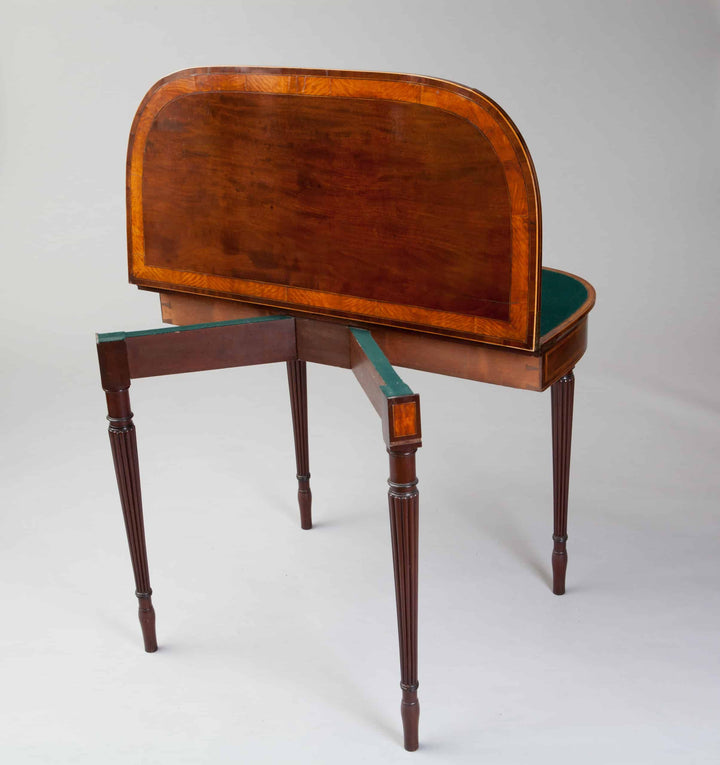 Pair Of George III Hepplewhite Mahogany Card Tables Attributed To Gillows with figured mahogany tops and fluted legs.