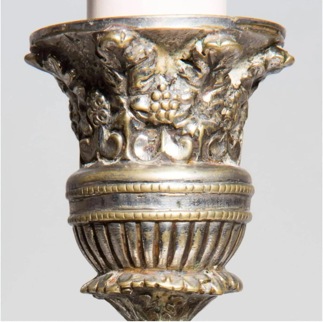 Pair of Silvered Putti Table Lamps with detailed foliate and grape leaf ornamentation on silver plated base.