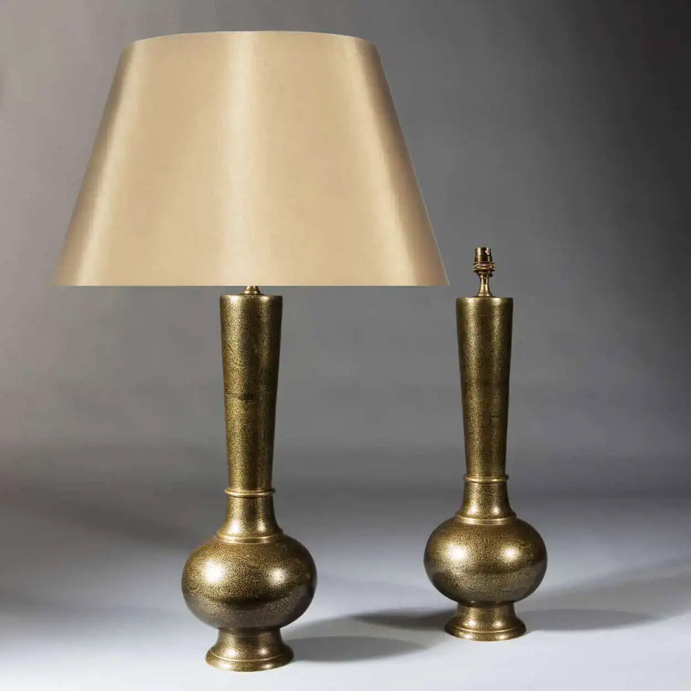 Pair Of Mogal Style Damascened Brass Table Lamps India circa 1900 with tall slender bases and beige shade