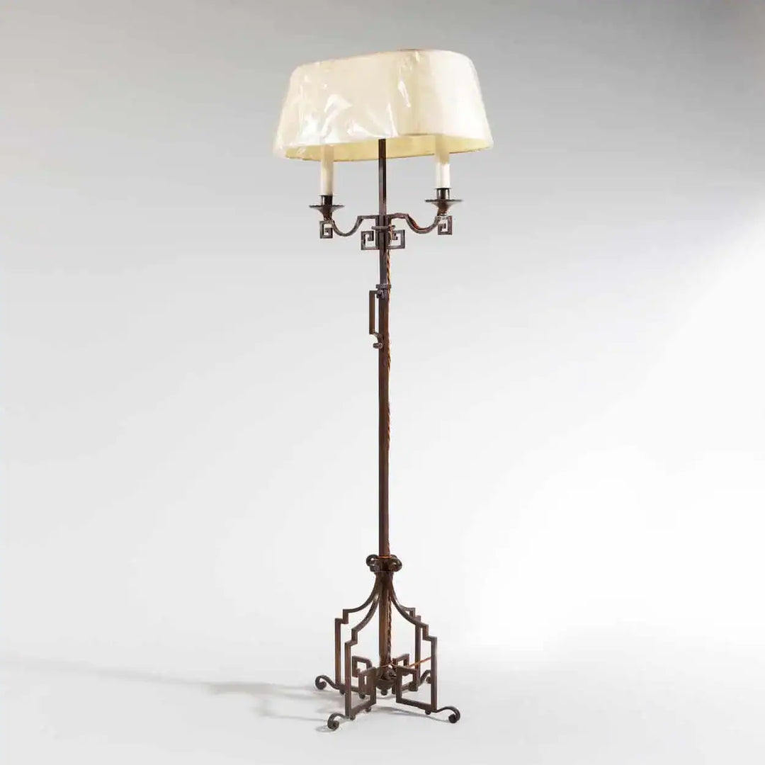 A patinated Steel floor standing bouillotte lamp