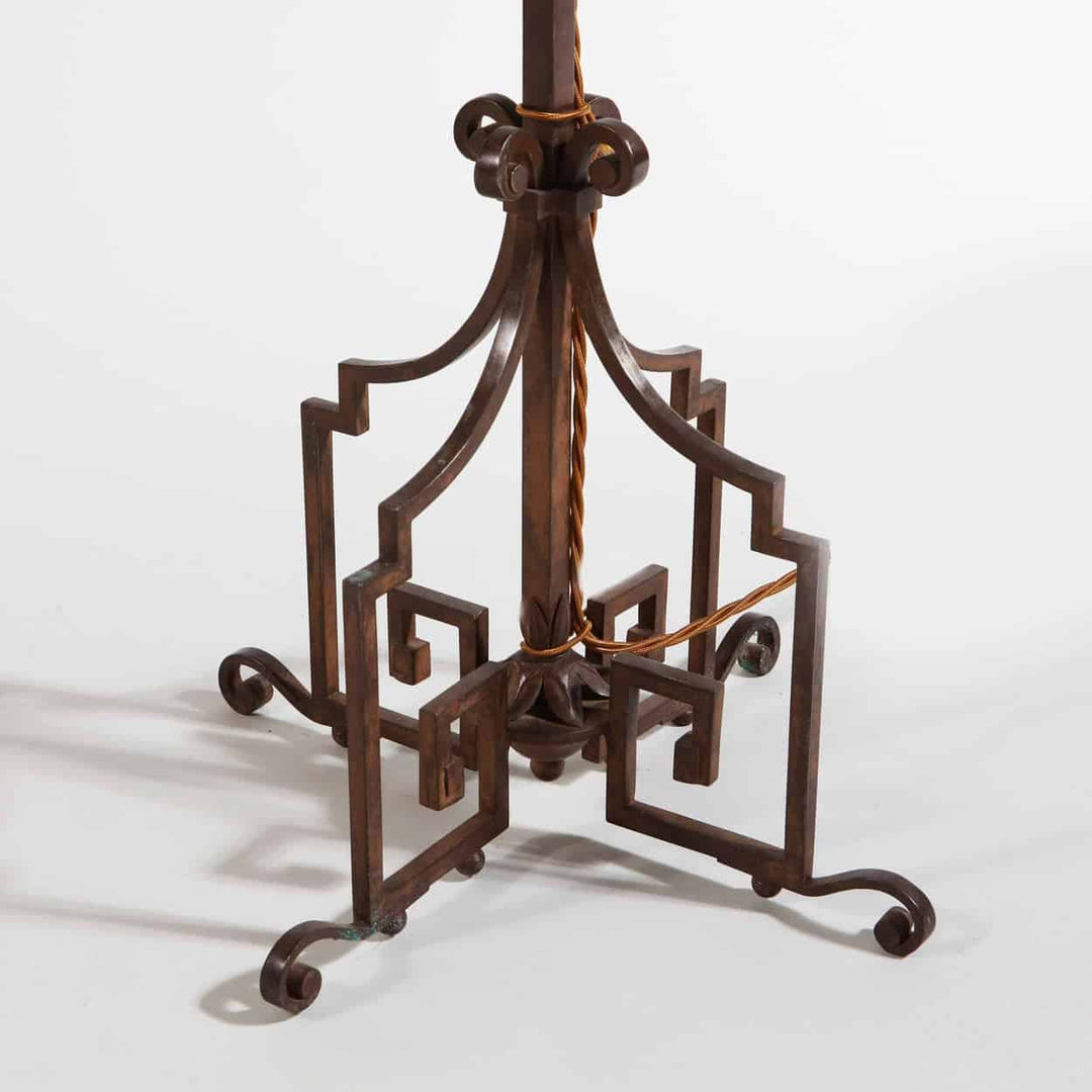 A patinated Steel floor standing bouillotte lamp