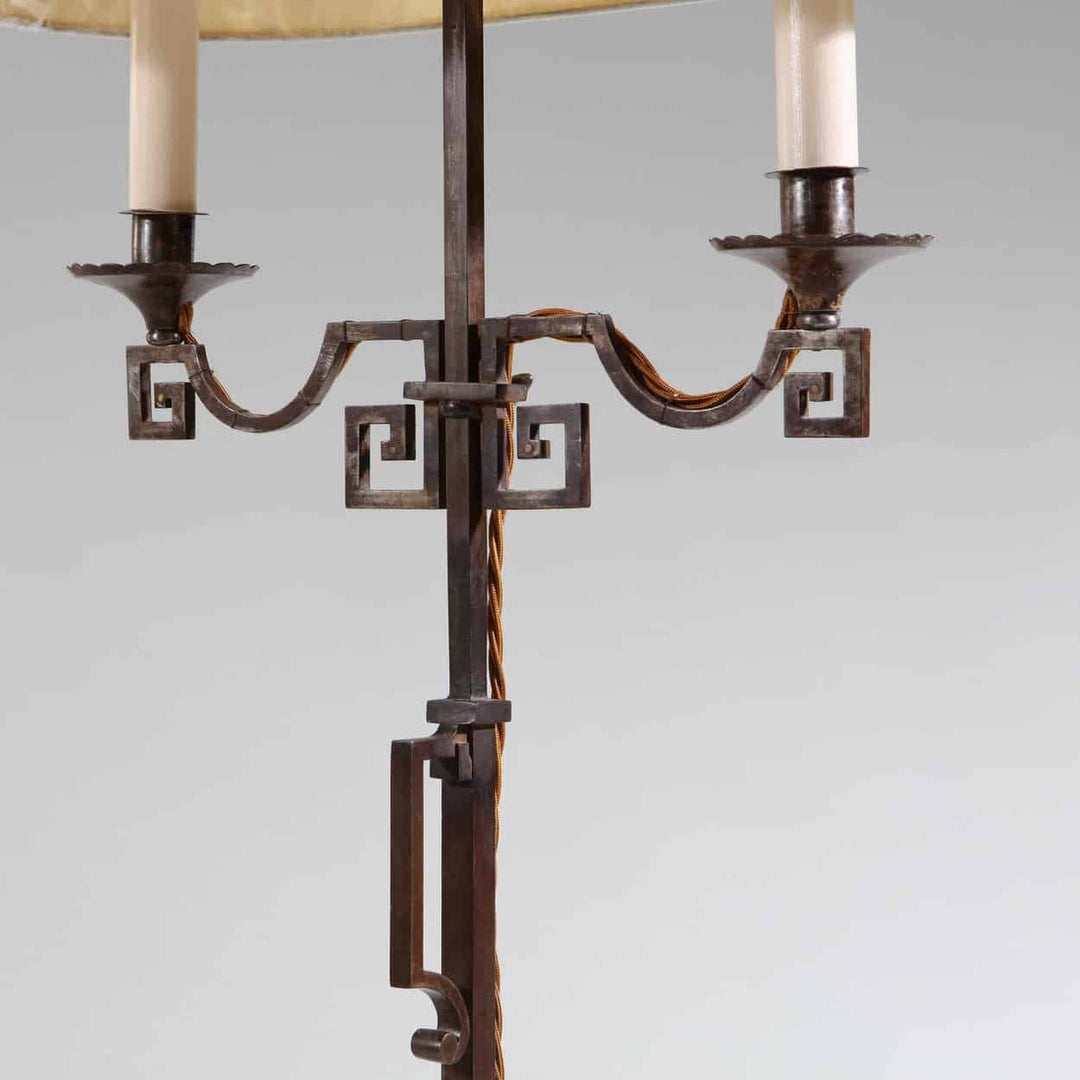 A patinated Steel floor standing bouillotte lamp