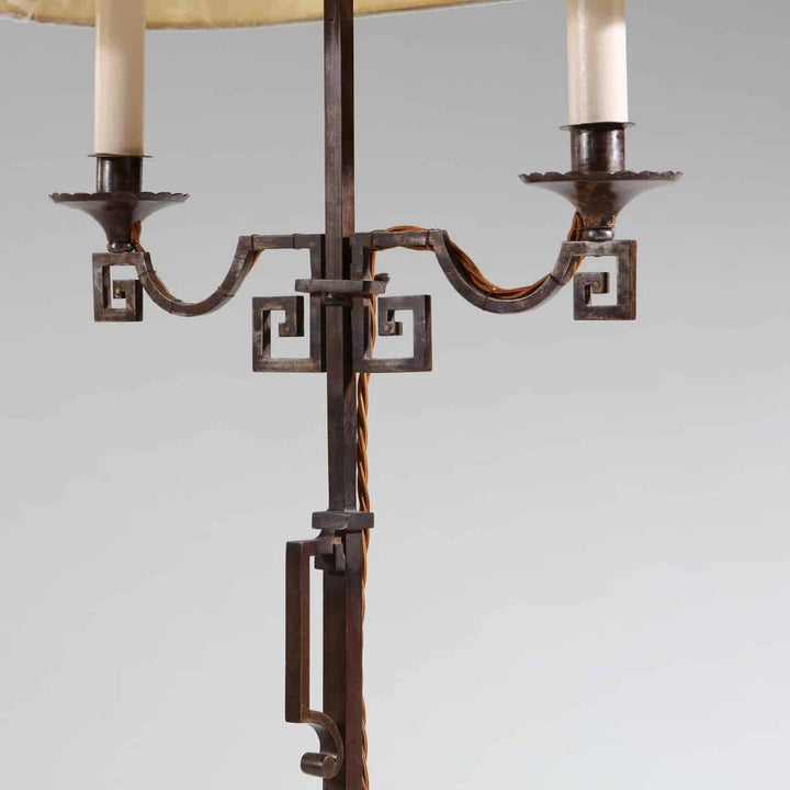 A patinated Steel floor standing bouillotte lamp