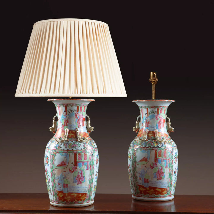 Pair of Chinese Canton Vases Mounted as Table Lamps with colorful 19th century porcelain court scenes and pleated shade.