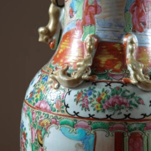 Pair of Chinese Canton Vases Mounted as Table Lamps with 19th century porcelain court scene decorations in blue, green, and pink.