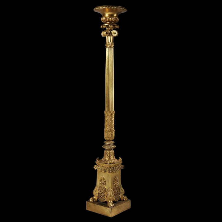 Empire Gilt Bronze Torchere Candle Stand with fluted column, foliate capital, and hairy paw feet, circa 1850 France.