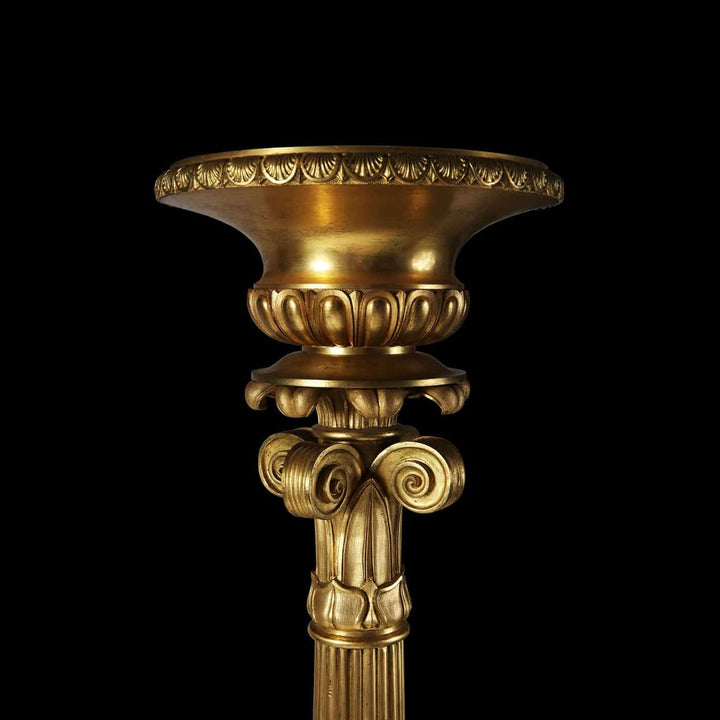 Empire Gilt Bronze Torchere Candle Stand with fluted column, foliate capital, and ornate gilt bronze detailing.