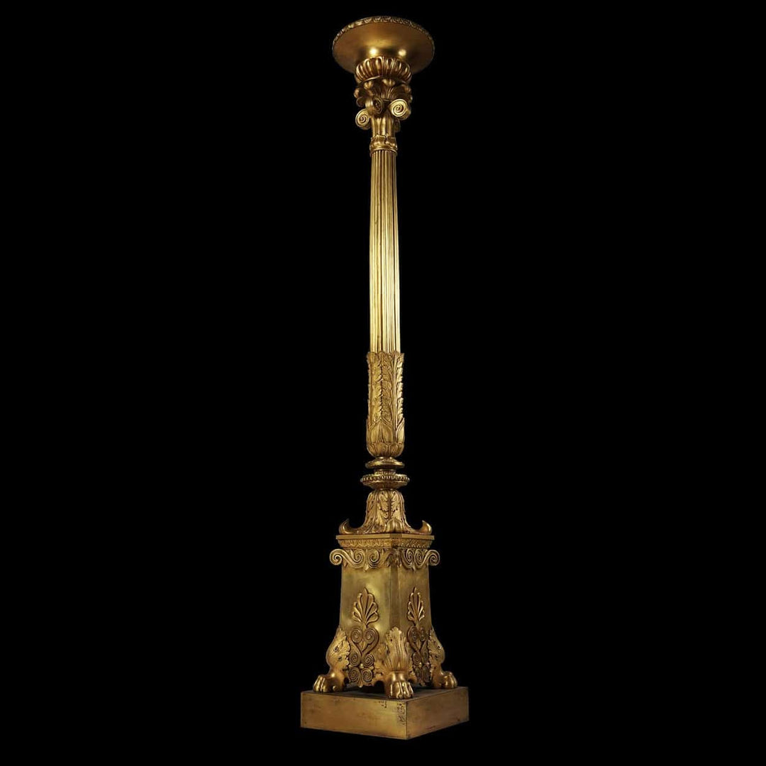 Empire Gilt Bronze Torchere Candle Stand with fluted column, foliate capital, and hairy paw feet, circa 1850 France.