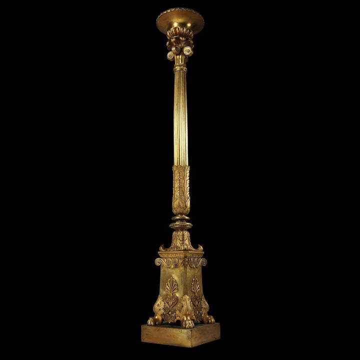 Empire Gilt Bronze Torchere Candle Stand with fluted column, foliate capital, and hairy paw feet, circa 1850 France.