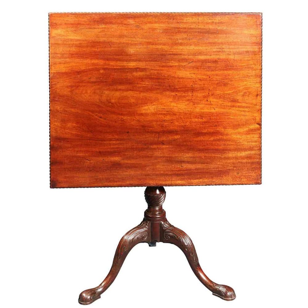 GEORGE III MAHOGANY RECTANGULAR TRIPOD TABLE with carved edges, birdcage tilt, fluted column, and cabriole legs circa 1770.
