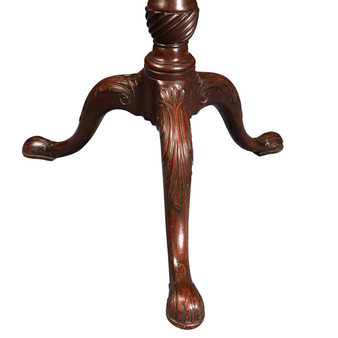 GEORGE III MAHOGANY RECTANGULAR TRIPOD TABLE detailed tripod base with fluted column and carved cabriole legs.