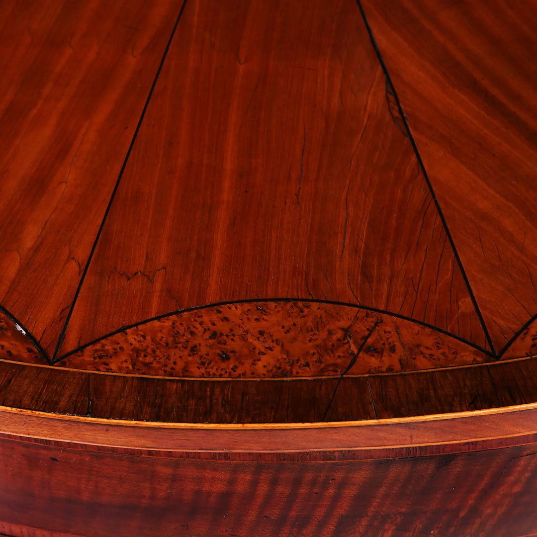 Close-up of the wood grain and satinwood details on the George III Irish Demi Lune Card Table circa 1780.