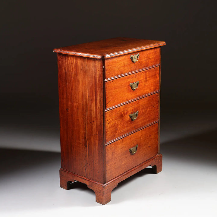 George I Pedestal Chest of Drawers in mahogany with four brass-handled drawers and ogee bracket feet, circa 1725.