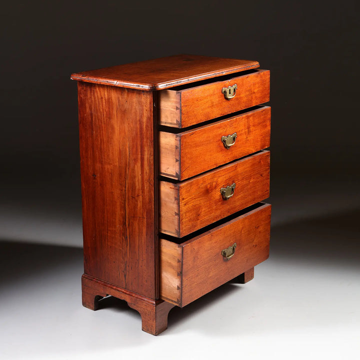 George I Pedestal Chest of Drawers with four brass-handled drawers on ogee bracket feet, early 18th century mahogany design.