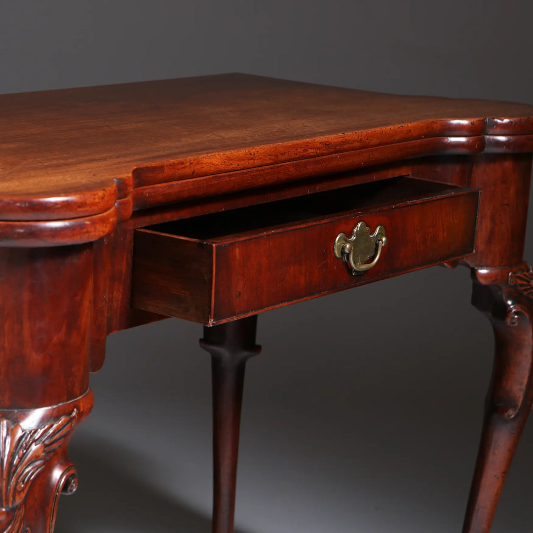 George II Mahogany Card Table with single drawer, cabriole legs, acanthus details, and elegant pad feet circa 1735.