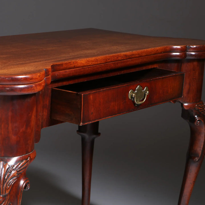 George II Mahogany Card Table with single drawer, cabriole legs, acanthus details, and elegant pad feet circa 1735.