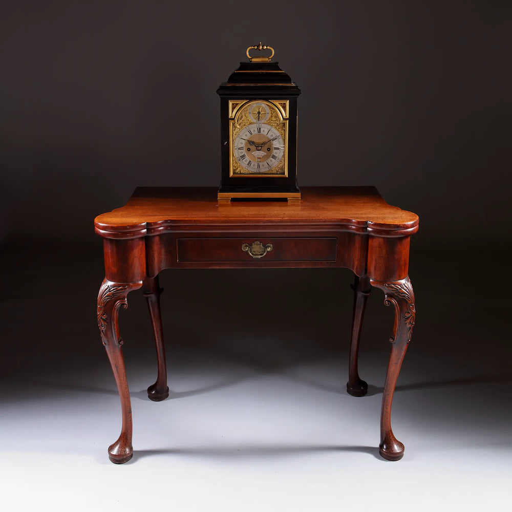 George II Mahogany Card Table with carved cabriole legs and elegant rounded candle-stand corners, circa 1735.