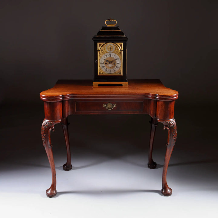 George II Mahogany Card Table with carved cabriole legs and elegant rounded candle-stand corners, circa 1735.
