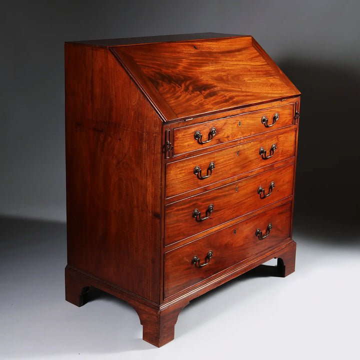 George III Bureau Desk Chest of Drawers mid 18th century mahogany with four drawers and drop handles on bracket feet