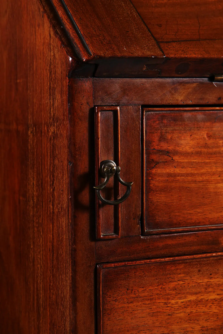Close-up of wood and handle detail on George III Bureau Desk Chest of Drawers, mid 18th century English antique furniture.