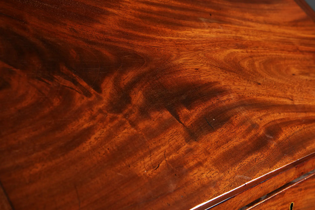 George III Bureau Desk Chest of Drawers showcasing rich grained timber and polished mid-18th century wooden surface detail.