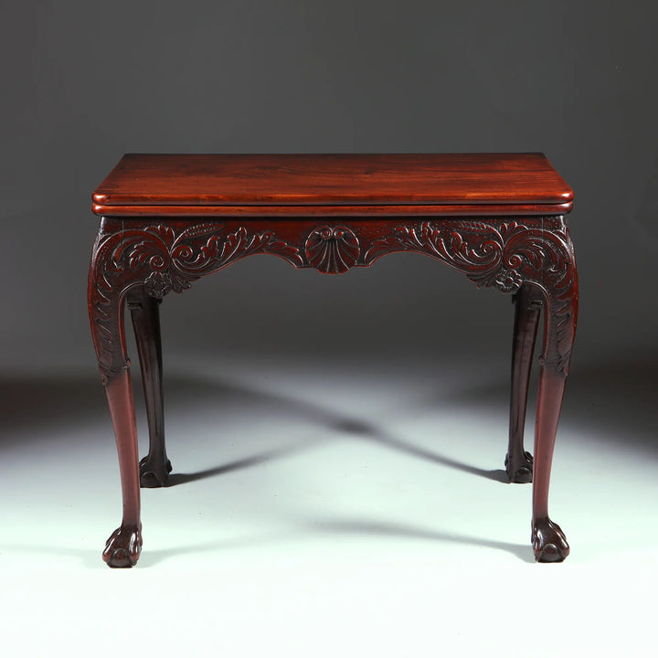 George II Irish Mahogany Card Table with carved frieze, cabriole legs, ball and claw feet, circa 1740 Ireland.