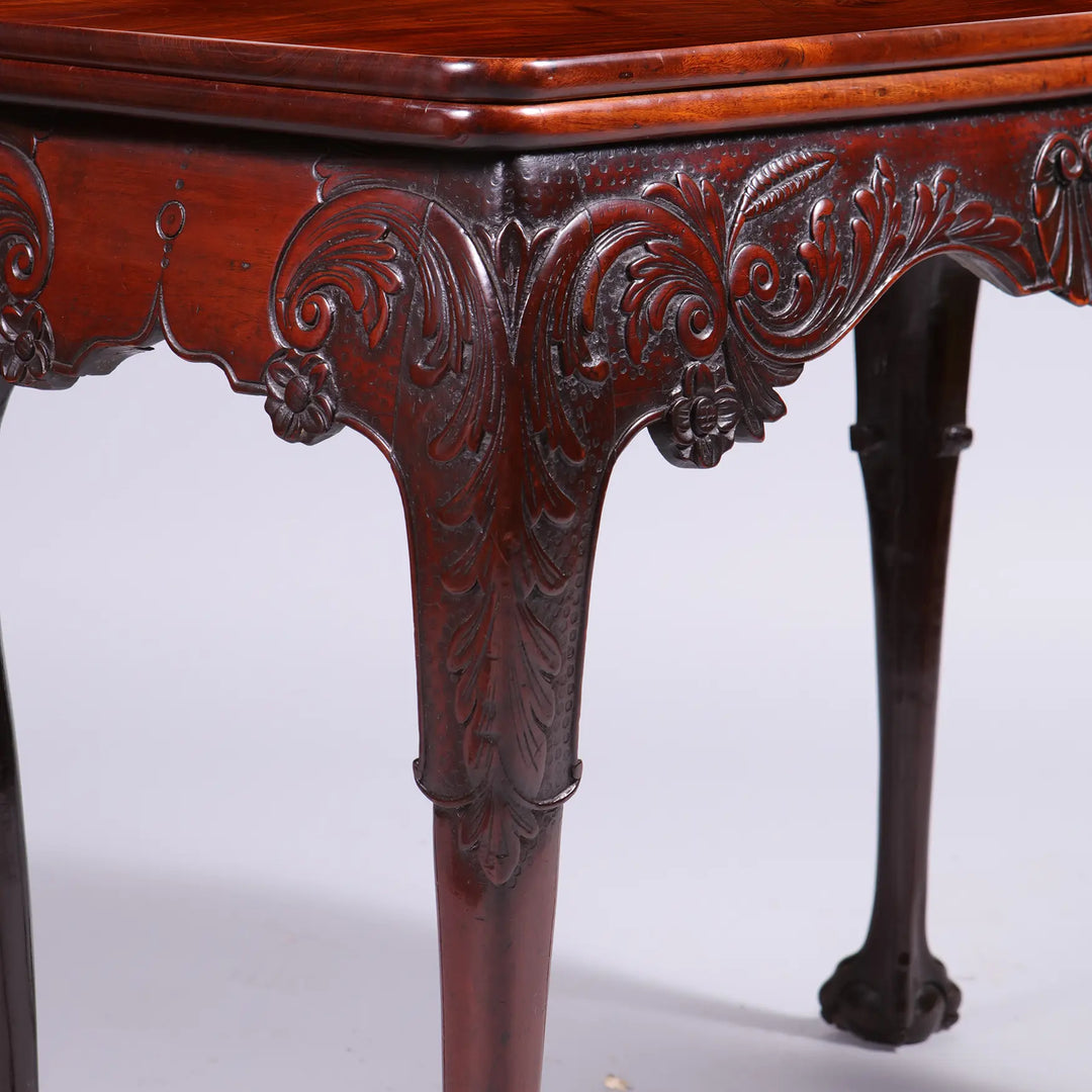 George II Irish Mahogany Card Table showing detailed high-relief carved frieze and cabriole leg with ball and claw foot