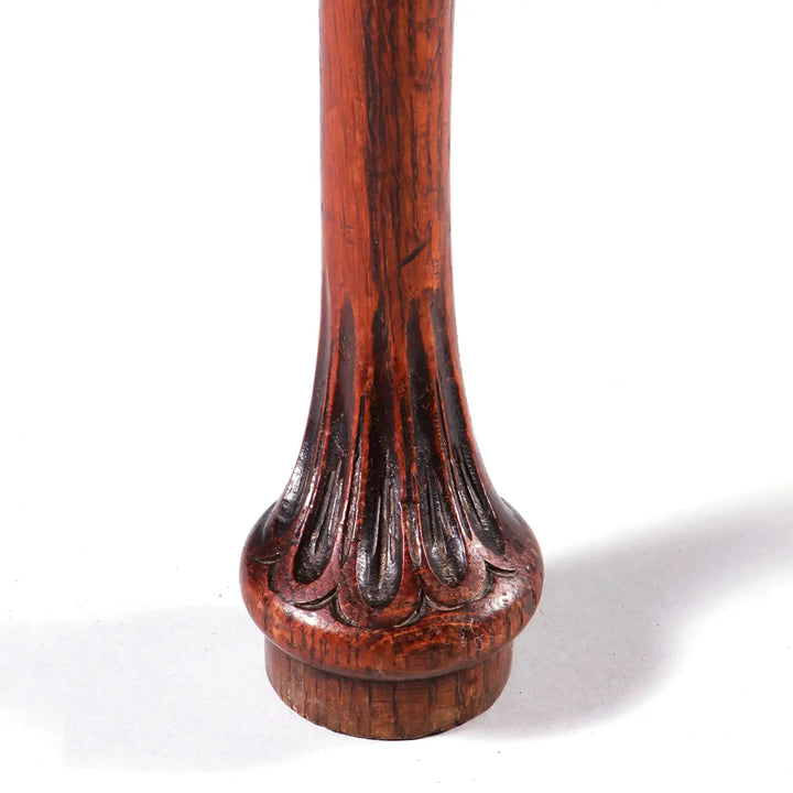 Close-up of carved cabriole leg detail on the GEORGE II OAK LOW BOY showcasing foliate and fluted design.