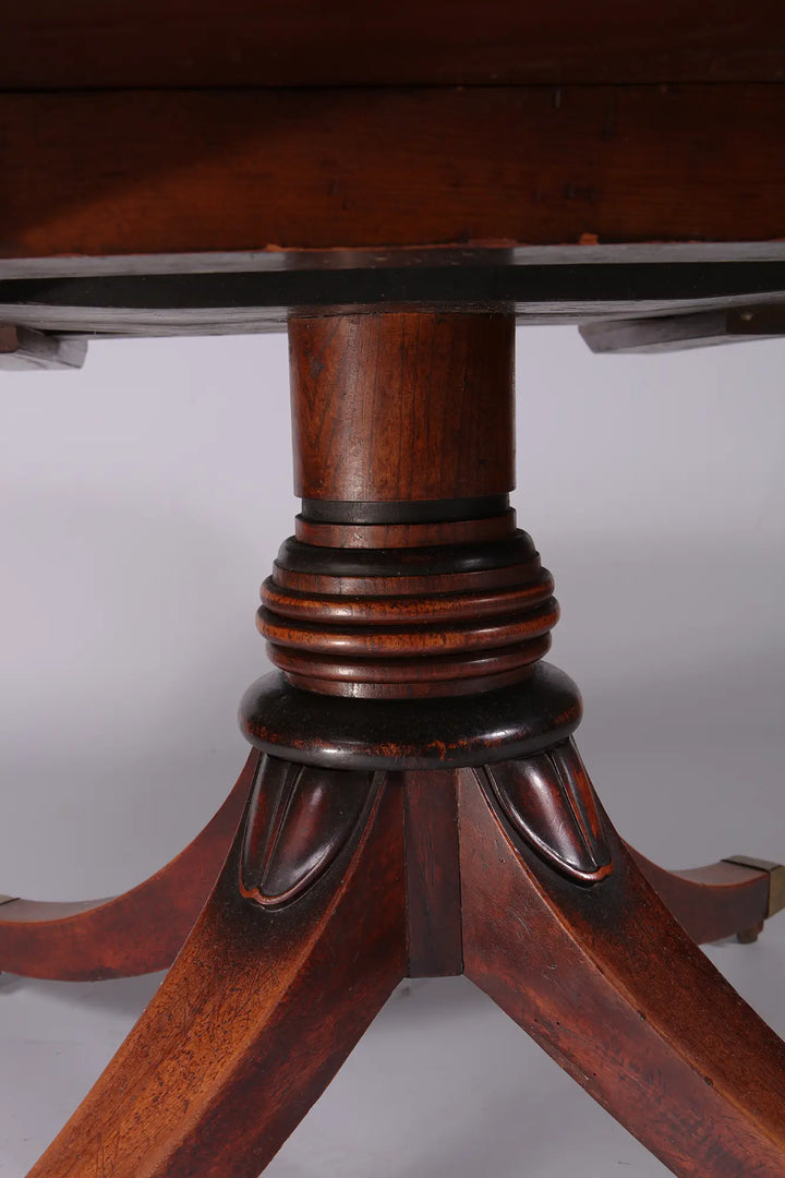 Extending Oval Dining Table in the Manner of George Bullock pedestal base with curved legs and mahogany finish circa 1815.