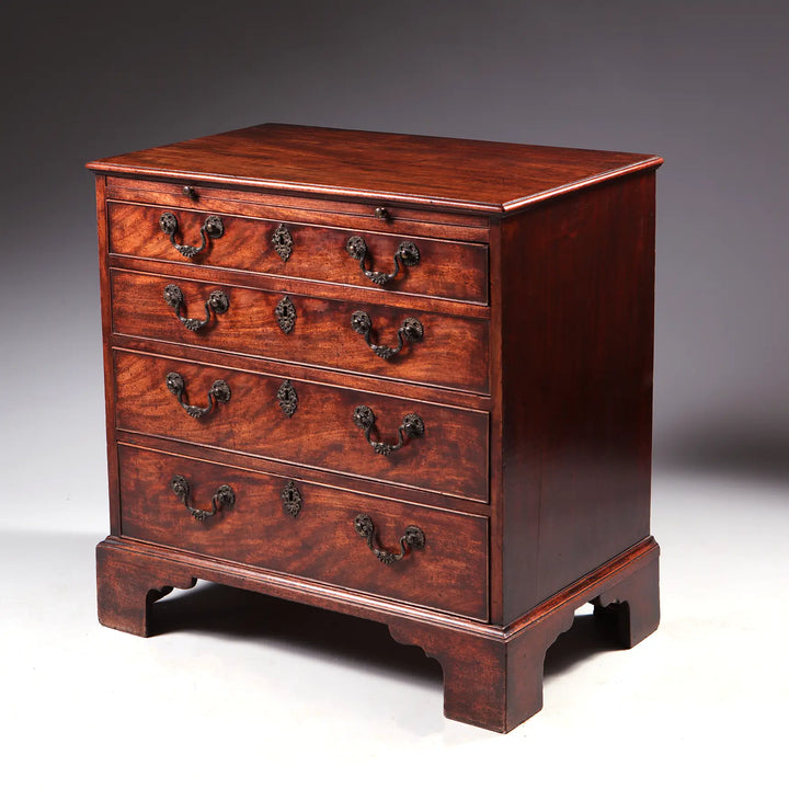 GEORGE II MAHOGANY CHEST OF DRAWERS mid-18th century antique chest with four drawers and oxidised handles on bracket feet.