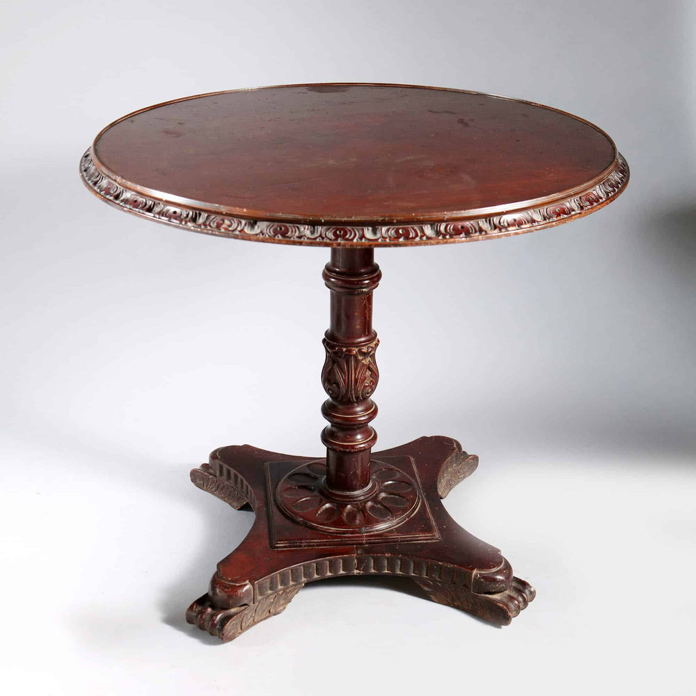 Matched Pair of Indian Circular End Tables with carved circular tops on column bases and scroll feet, India circa 1900.