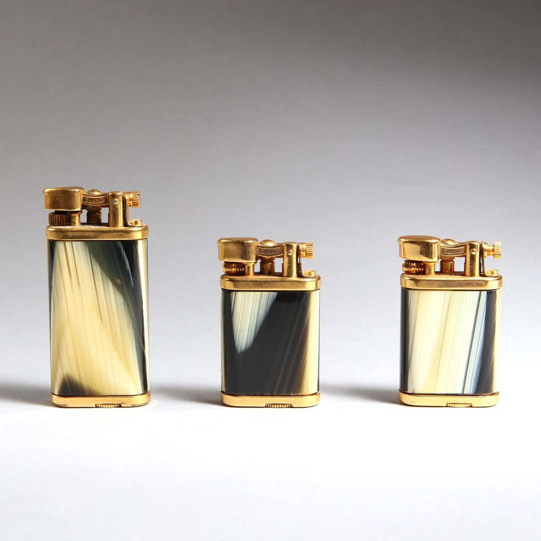 Collection of Three Dunhill Unique Gold Plated Horn Lighters