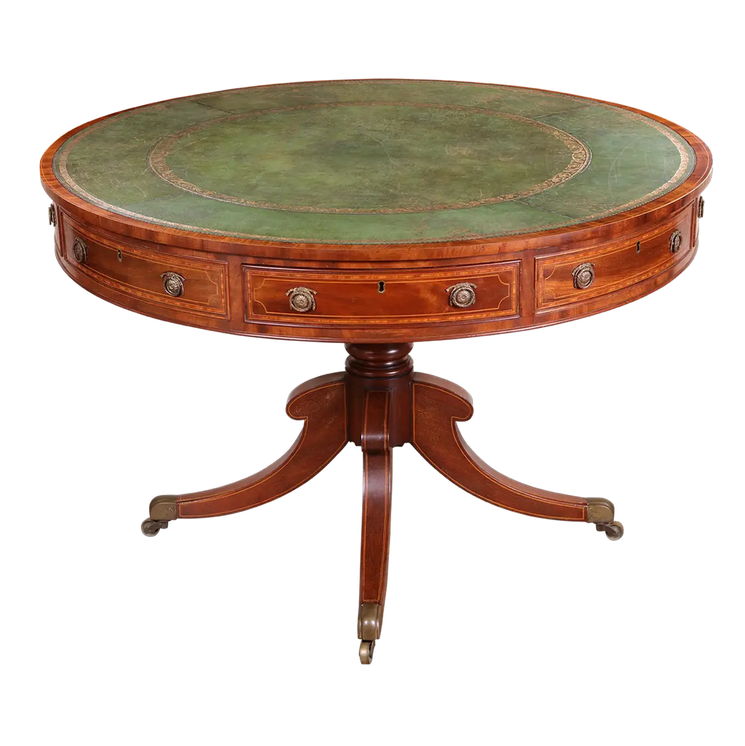 Sheraton Mahogany Drum Table with tooled leather top, crossbanded mahogany, boxwood stringing, and pedestal base with brass castors.