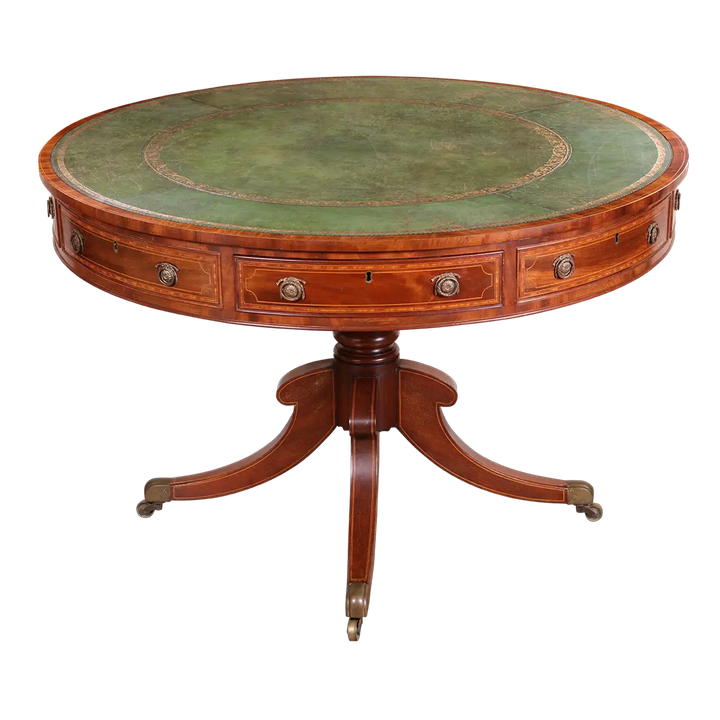 Sheraton Mahogany Drum Table with tooled leather top, crossbanded mahogany, boxwood stringing, and pedestal base with brass castors.