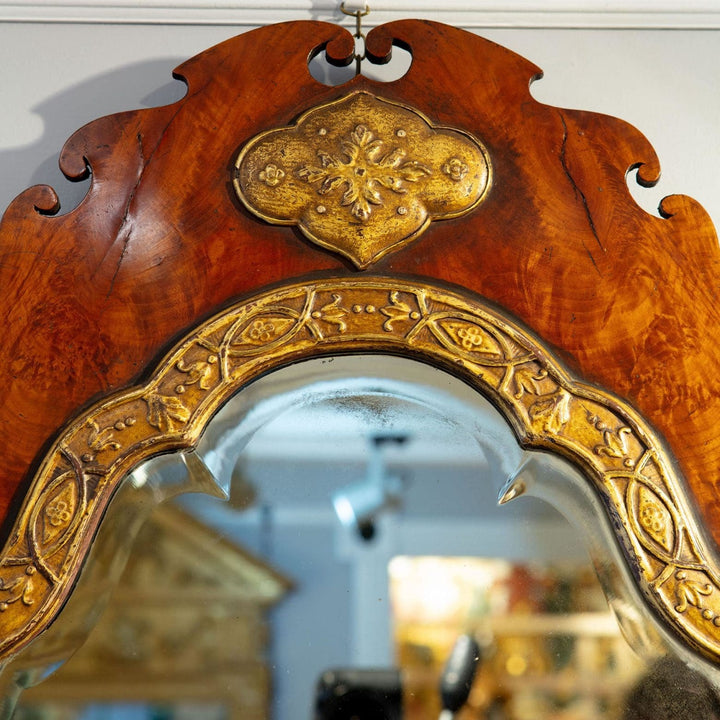 A George III flame veneered mahogany wall mirror
