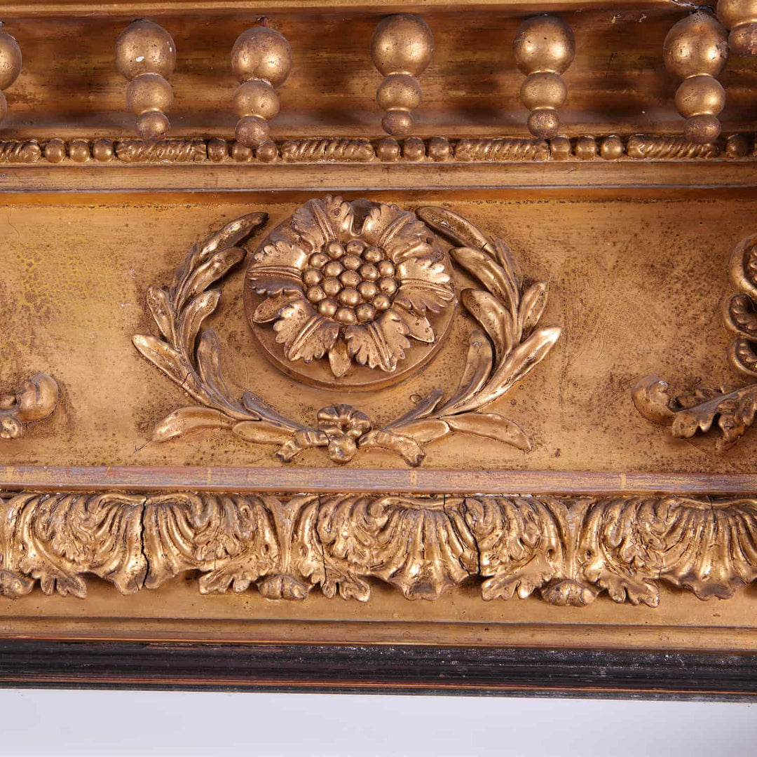 Overmantel Mirror from Embley Park giltwood frame detail with floral motif and classical decorations in aged patina.