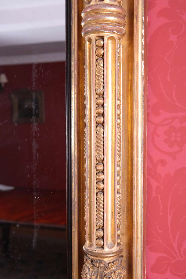 Overmantel Mirror from Embley Park with detailed giltwood frame and classical decorative elements in aged condition.