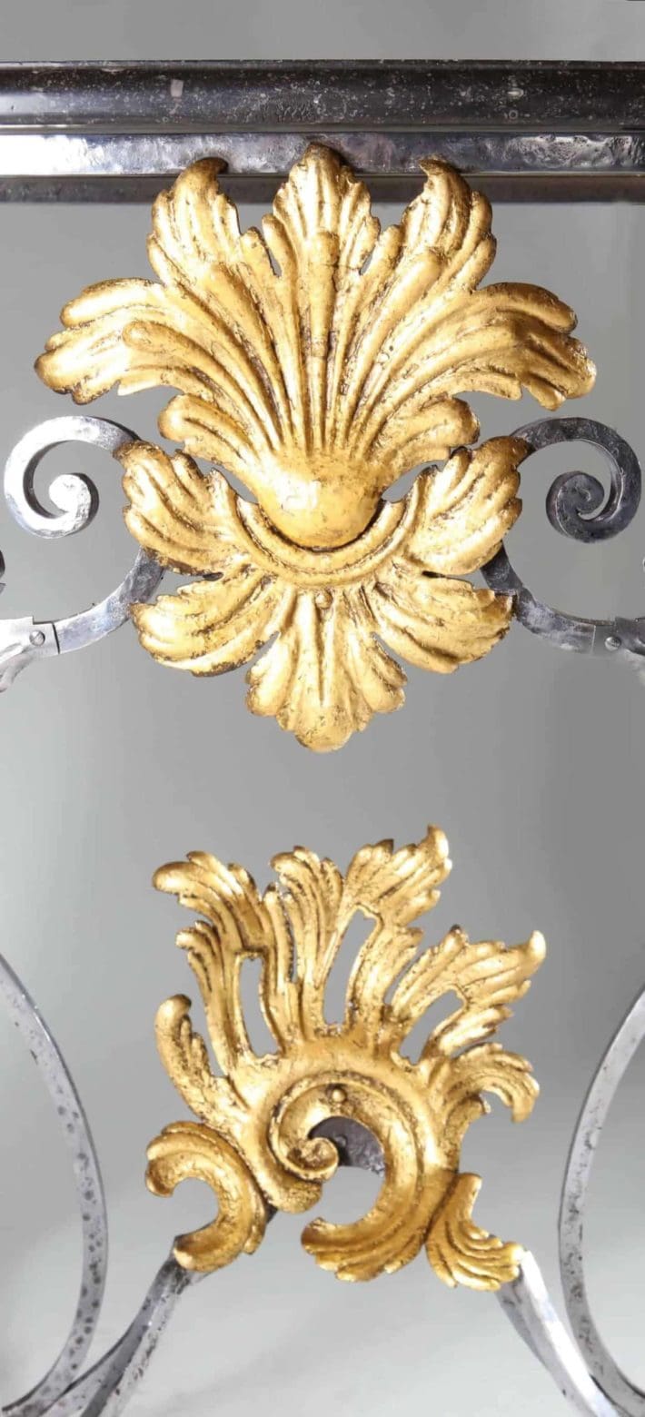 Louis XV Steel and Gilt Metal Console Table close-up showing gilt foliate scroll decorations on wrought steel frame.
