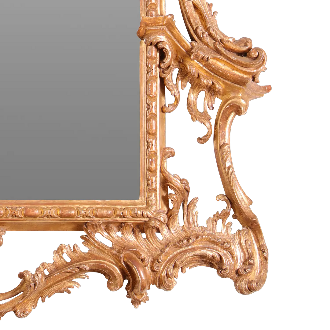 George II Giltwood Pier Mirror with ornate carved giltwood rococo frame featuring scrolling acanthus leaves and floral designs.