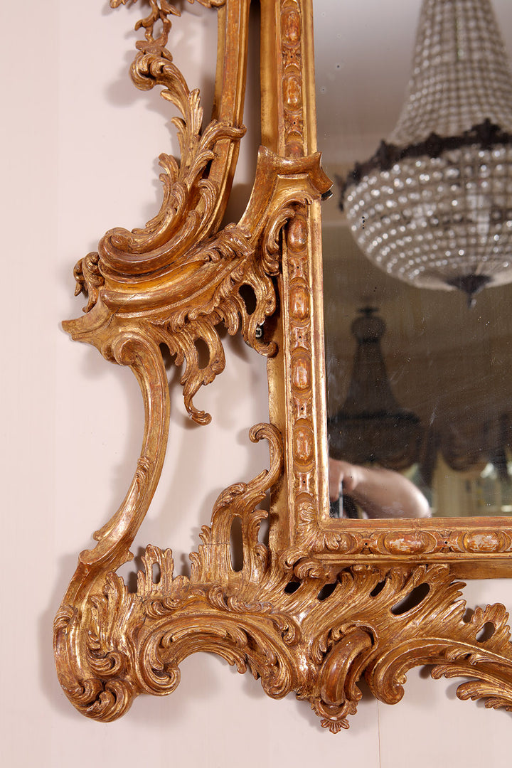 George II Giltwood Pier Mirror with intricate rococo carved scrolling acanthus and floral giltwood frame.