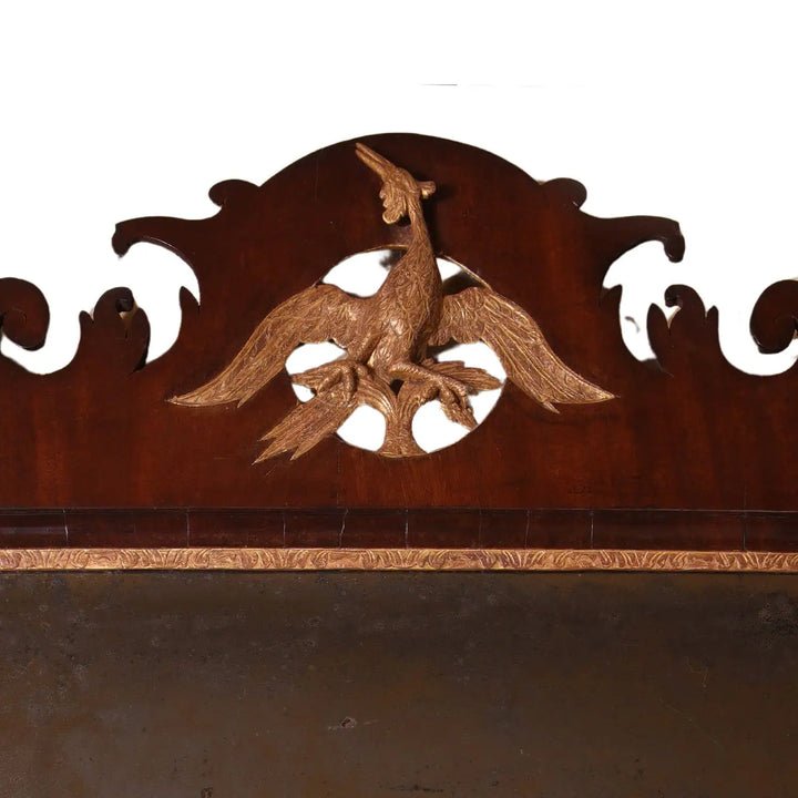 Fret-Cut George III Mahogany Veneered Mirror with Gilt Ho-Ho Bird featuring original hand bevelled Vauxhall mirror plate.