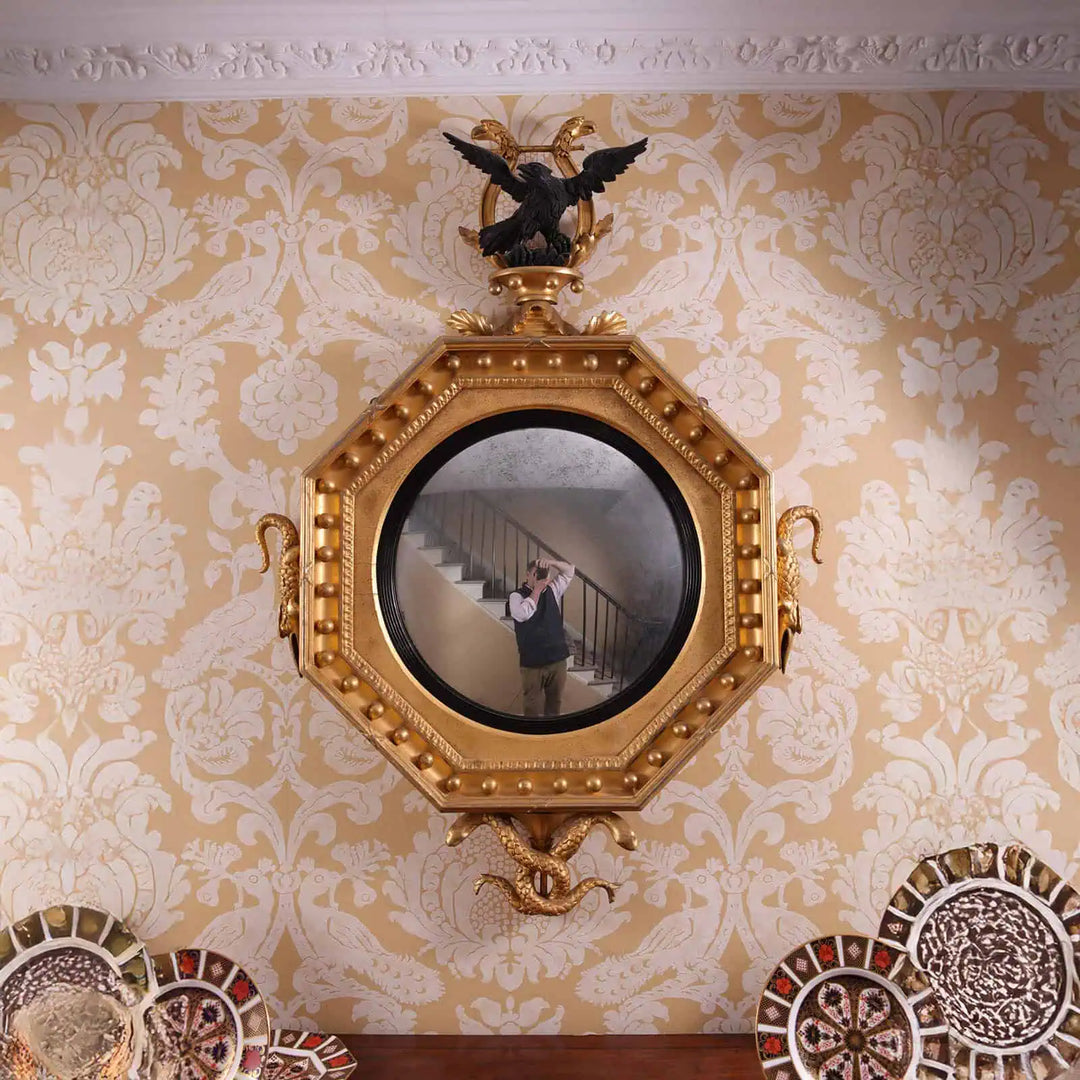 Rare Early 19th Century Regency Octagonal Convex Mirror with giltwood frame, eagle, crocodile, and serpent carvings.