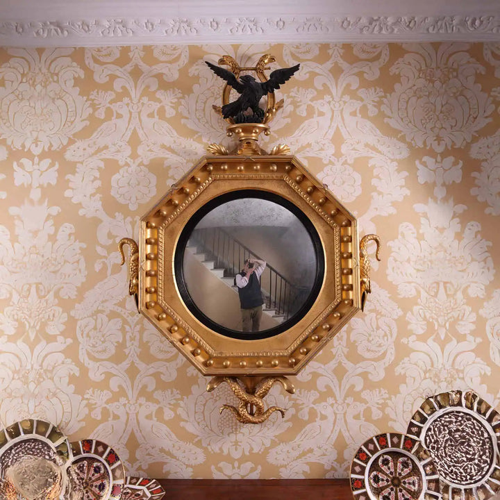 Rare Early 19th Century Regency Octagonal Convex Mirror with giltwood frame, eagle, crocodile, and serpent carvings.