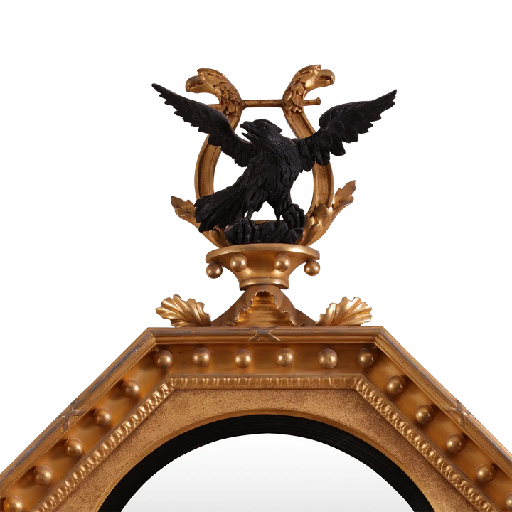 Rare Early 19th Century Regency Octagonal Convex Mirror with giltwood frame and ebonised carved eagle crest.
